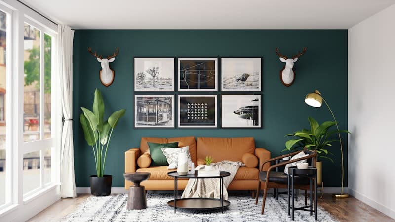 Deep green feature wall with tan leather sofa